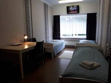 Фото номера Трехместный номер с общей ванной комнатой Гостевой дом Sõrve Guest House г. Сальме 2